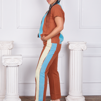 Side view of Hand-Painted Stripe Western Pants in Burnt Terracotta and matching Pantry Button-Up worn by Gabi