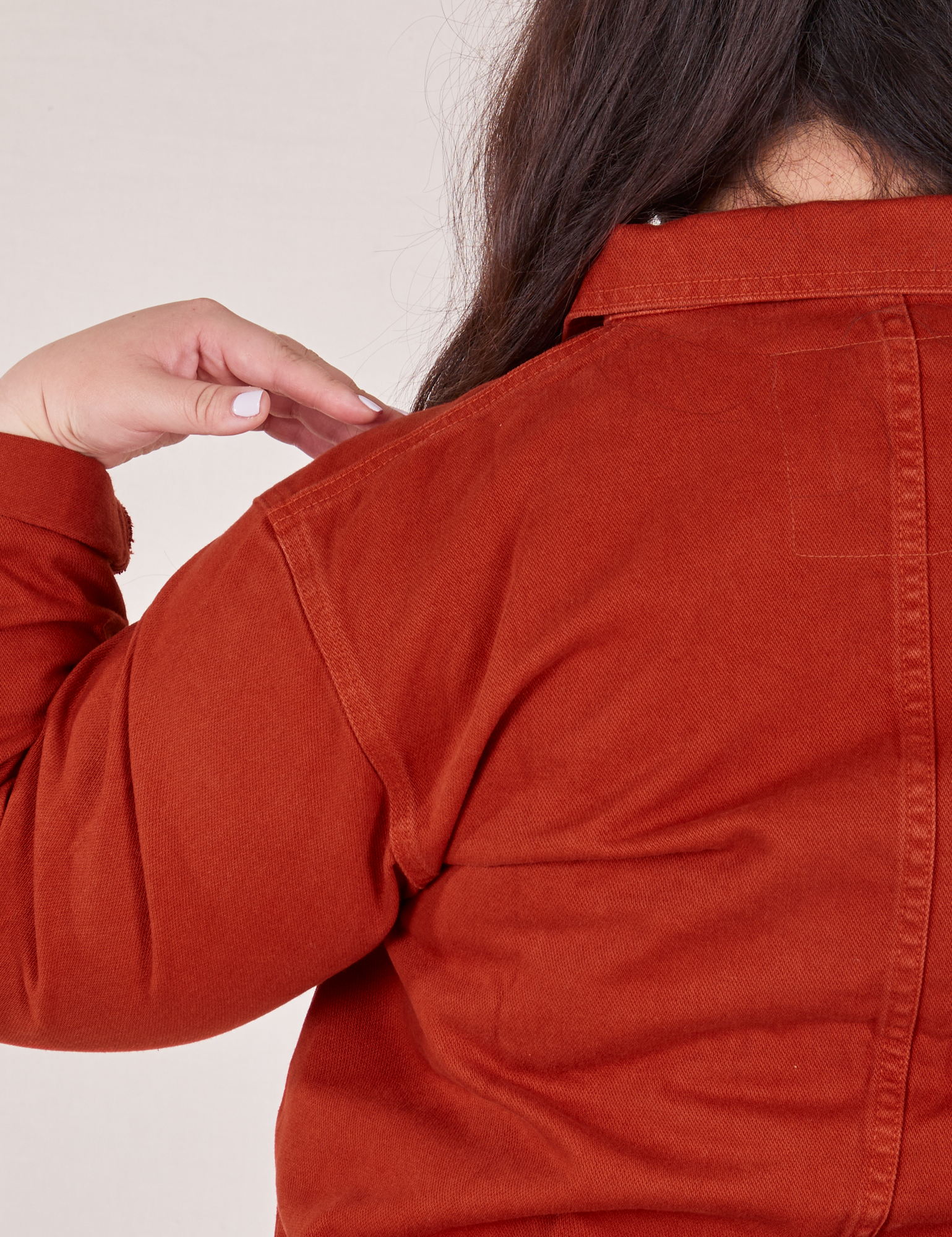 Close up back view of Denim Work Jacket in Paprika worn by Ashley.