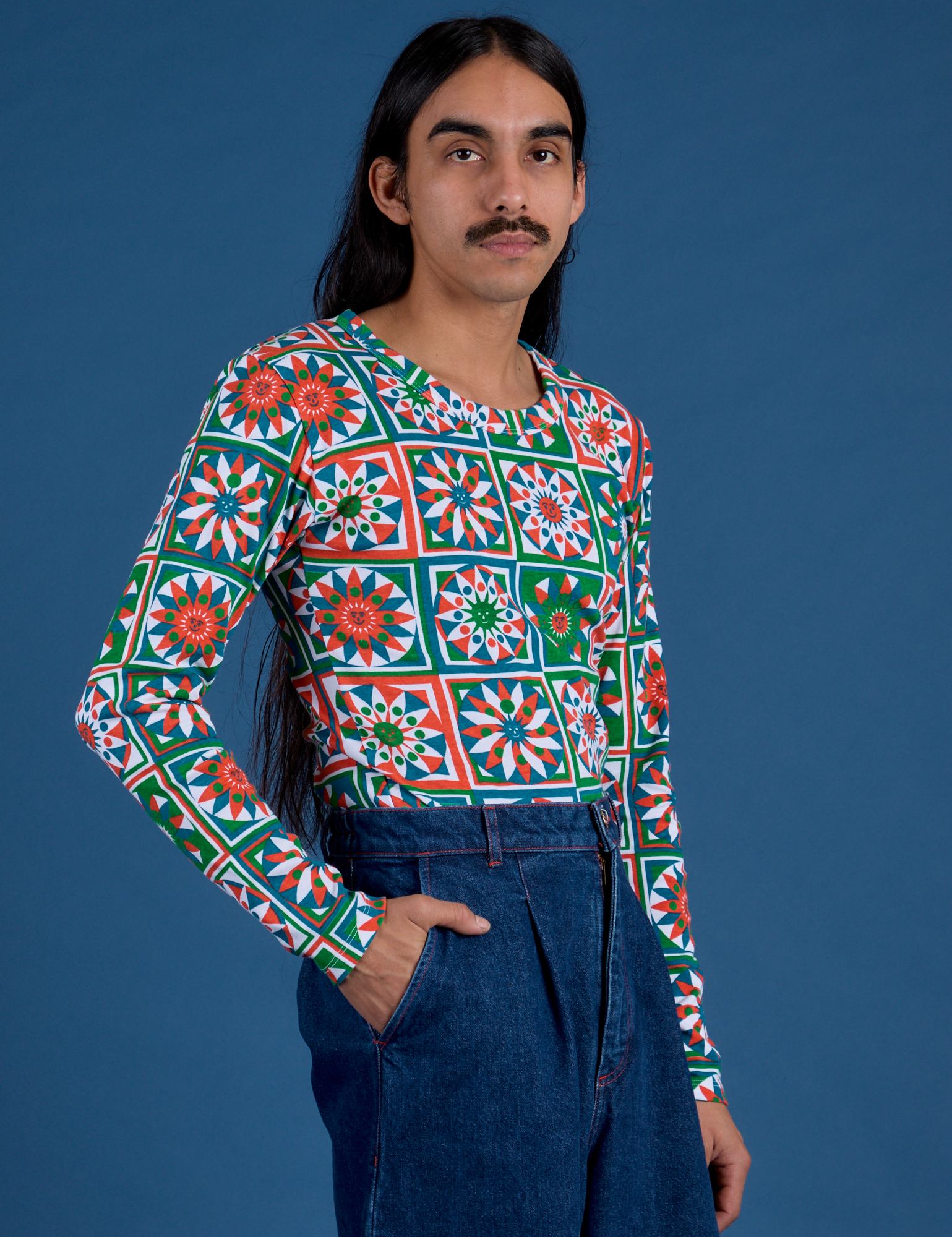 Angled front view of Long Sleeve Baby Tee in Quilt Print on Anthony