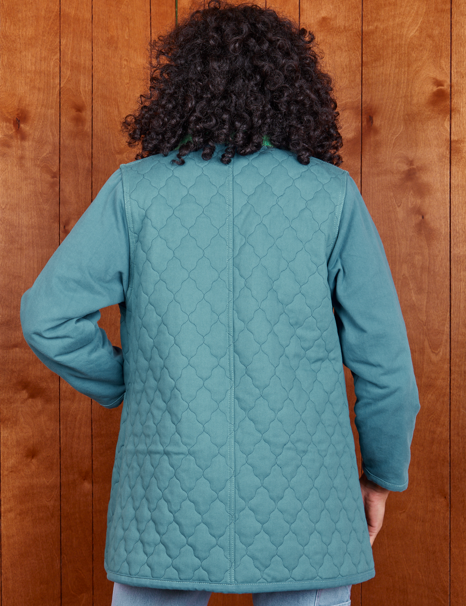 Back view of Quilted Overcoat in Marine Blue on Jesse