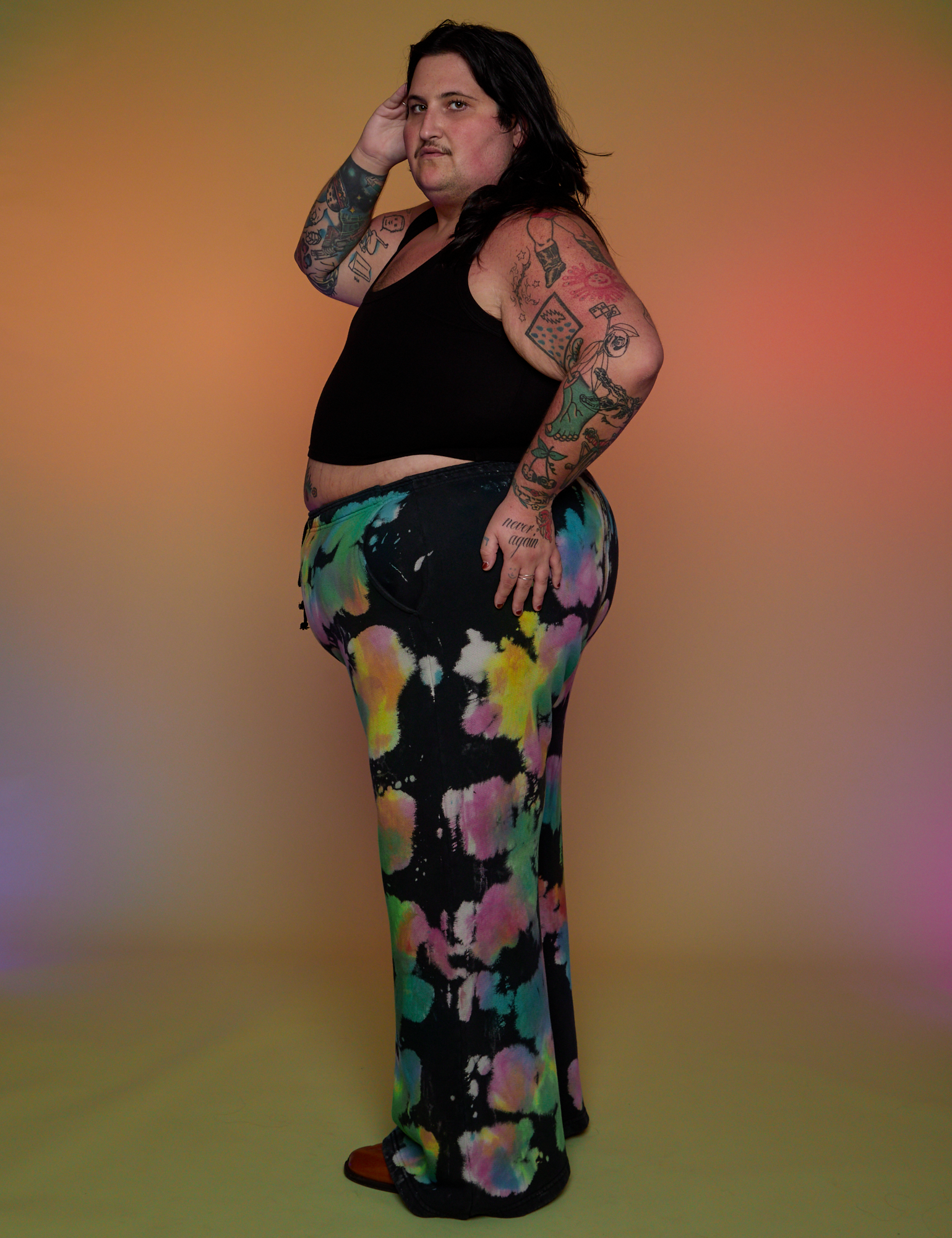 Side view of Tie Dyed Wide Leg Sweat Pants and Cropped Tank in Black on Sam