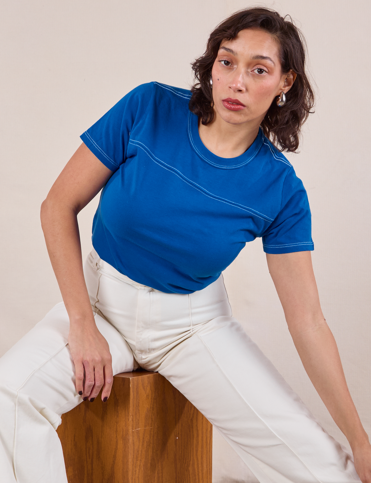 Tiara is wearing JV Tee in Royal Blue and vintage tee off-white Western Pants