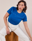 Tiara is wearing JV Tee in Royal Blue and vintage tee off-white Western Pants