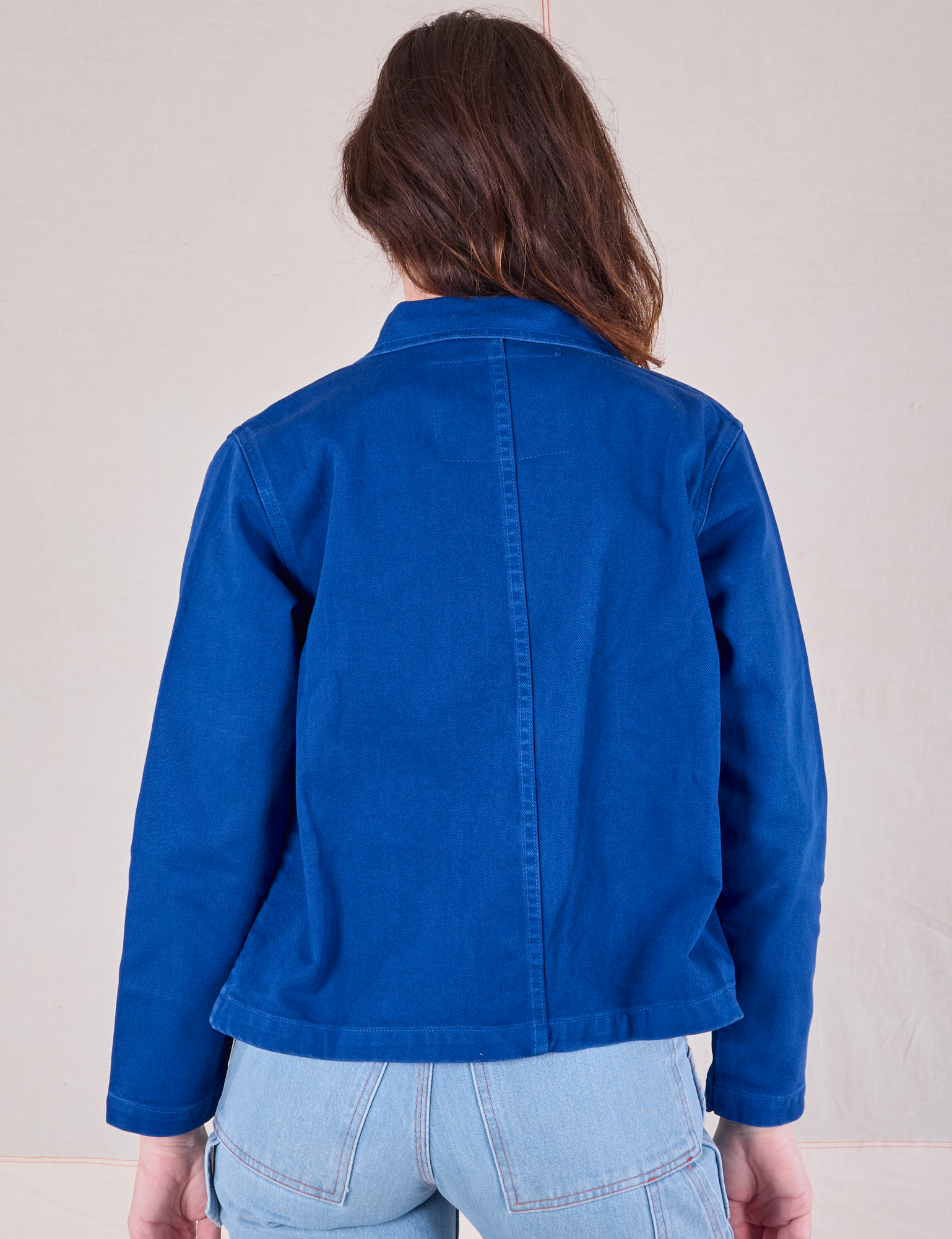 Denim Work Jacket in Royal Blue back view on Alex