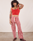 Jesse is 5'8" and wearing XS Work Pants in Cherry Stripe paired with mustang red Cropped Cami