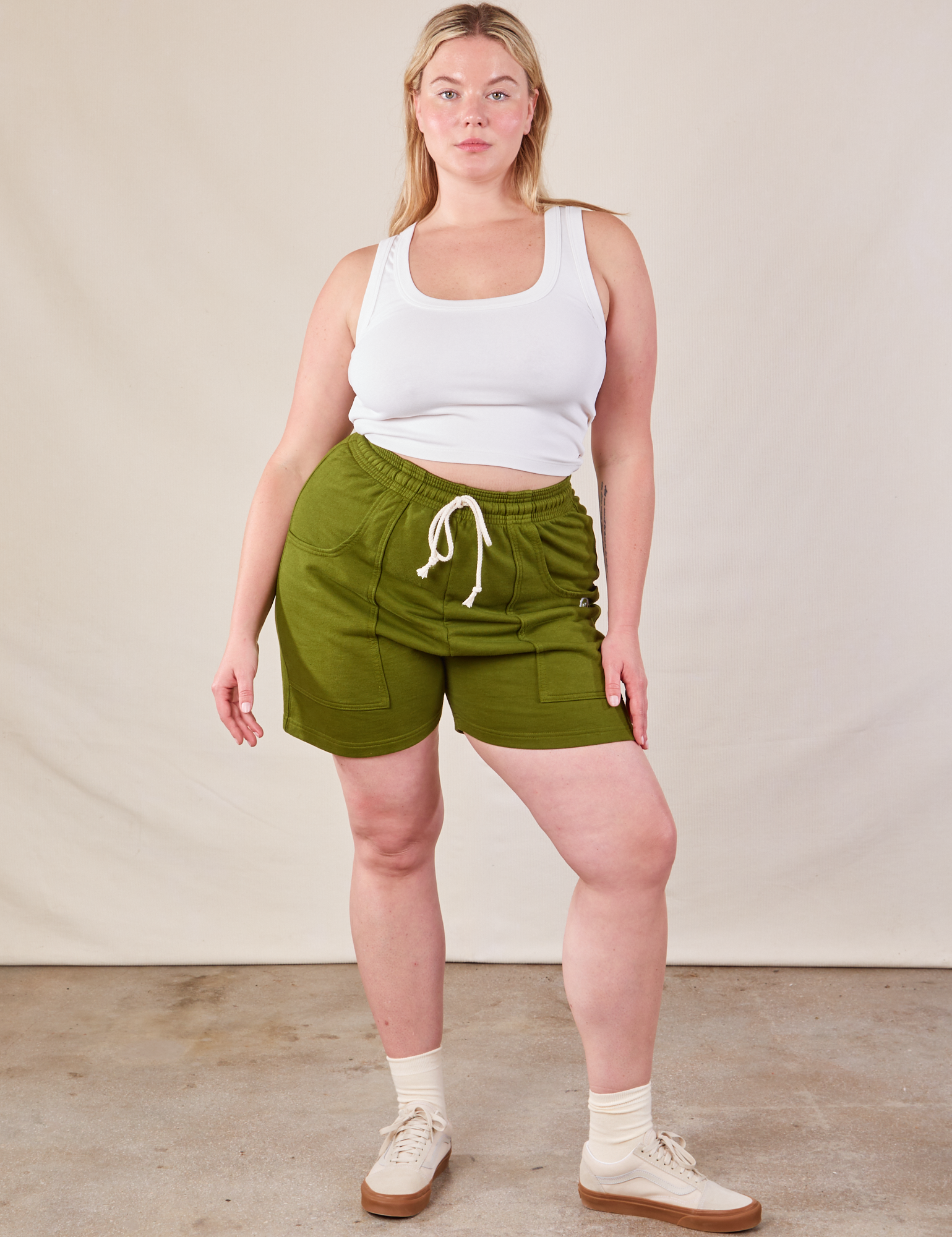 Lish is wearing Lightweight Sweat Shorts in Summer Olive and Cropped Tank in vintage tee off-white
