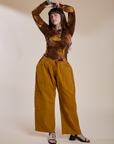 Sydney is wearing Long Sleeve Baby Tee in Honey Brown and spicy mustard Drop Pocket Cargo Pants