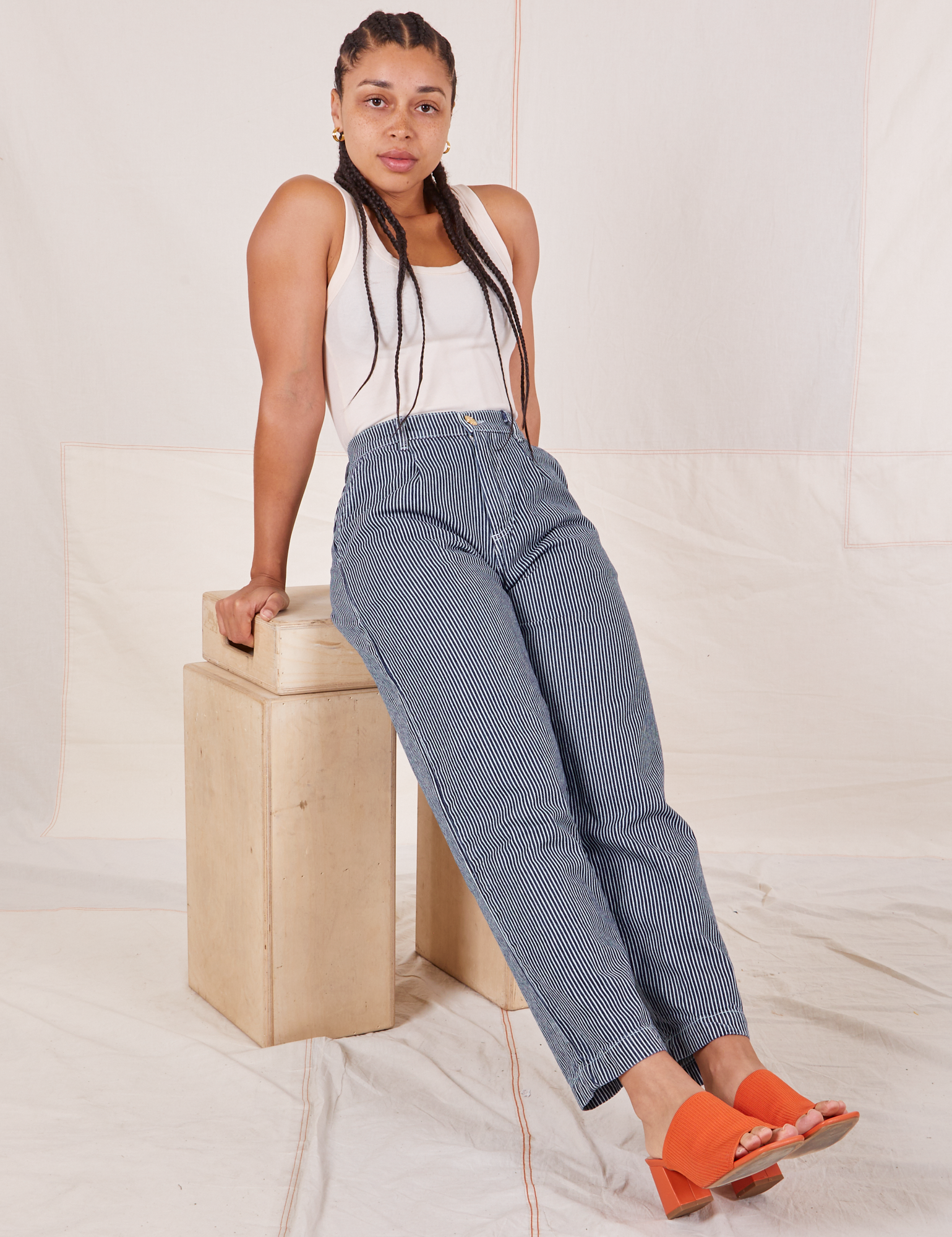 Gabi is wearing Denim Trouser Jeans in Railroad Stripe and a vintage off-white Tank Top