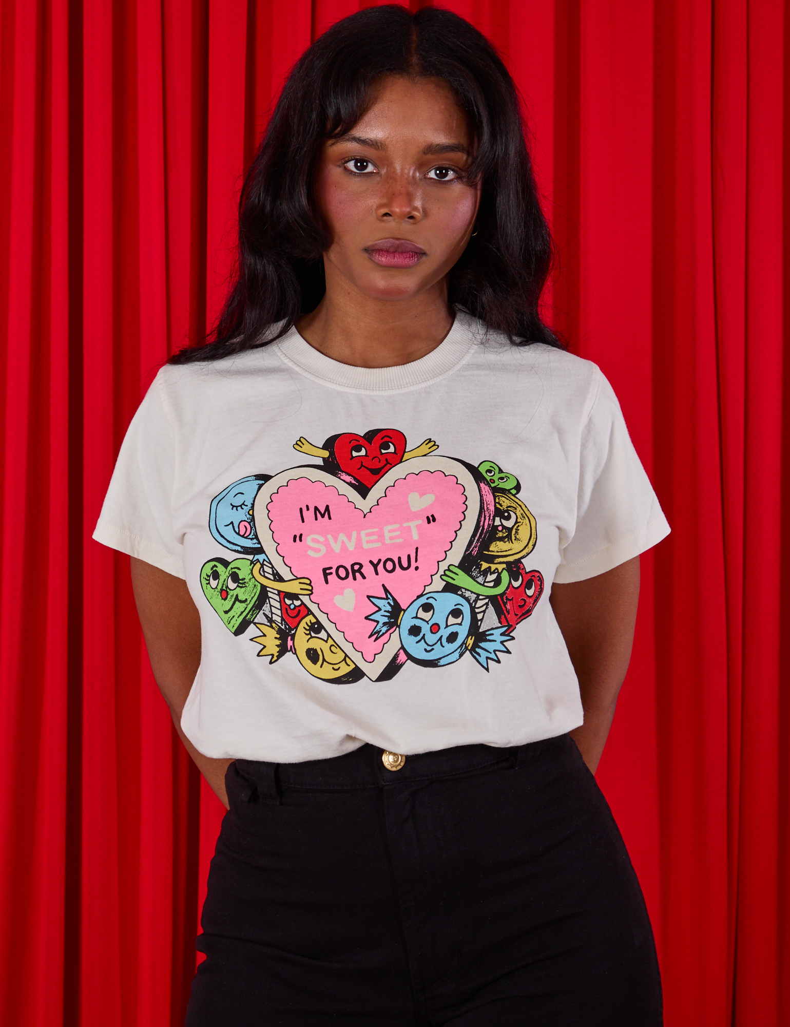 Kandia is wearing a tucked in Sweet 4 U Organic Tee