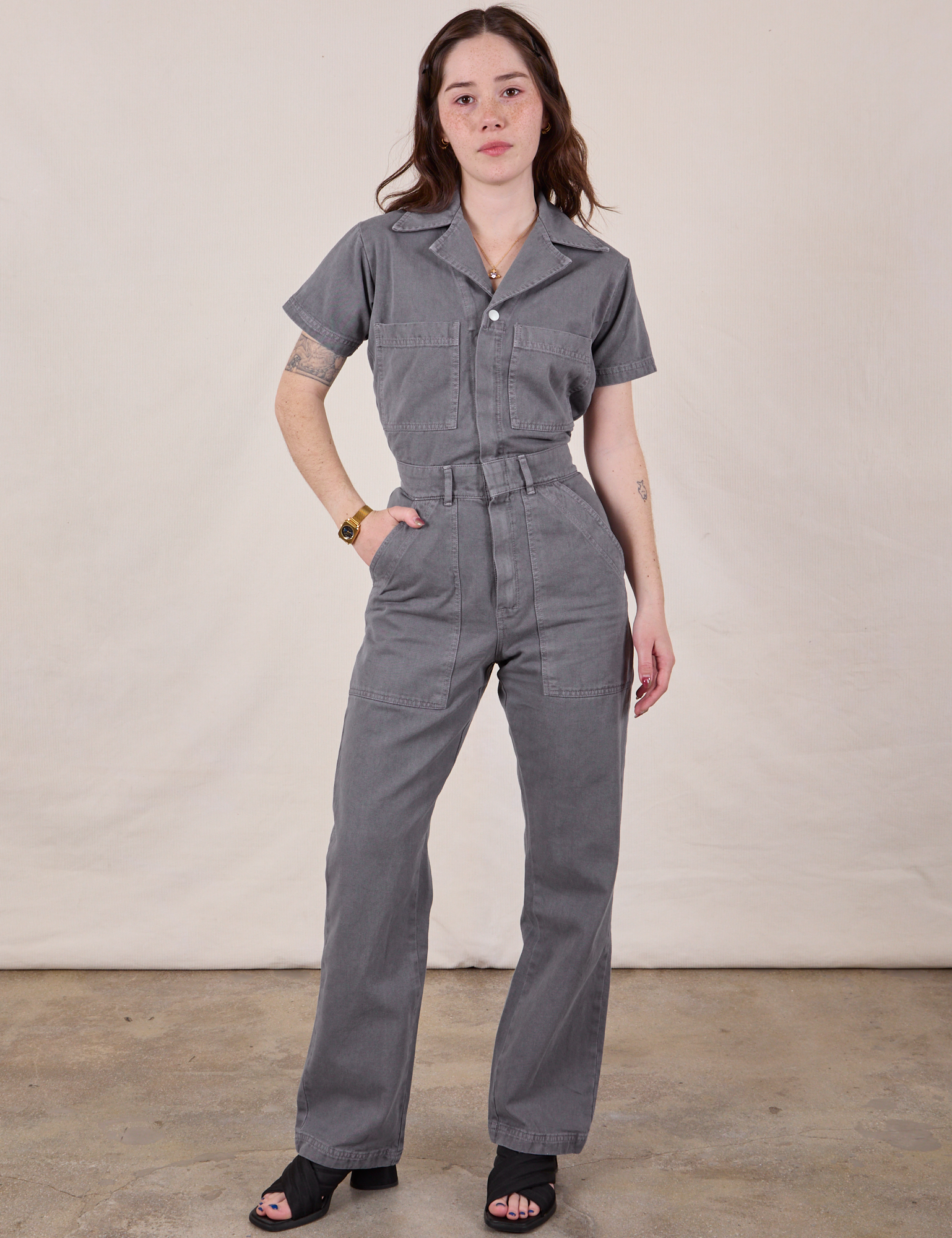 Hana is 5&#39;3&quot; and wearing XXS Short Sleeve Jumpsuit in Washed Grey