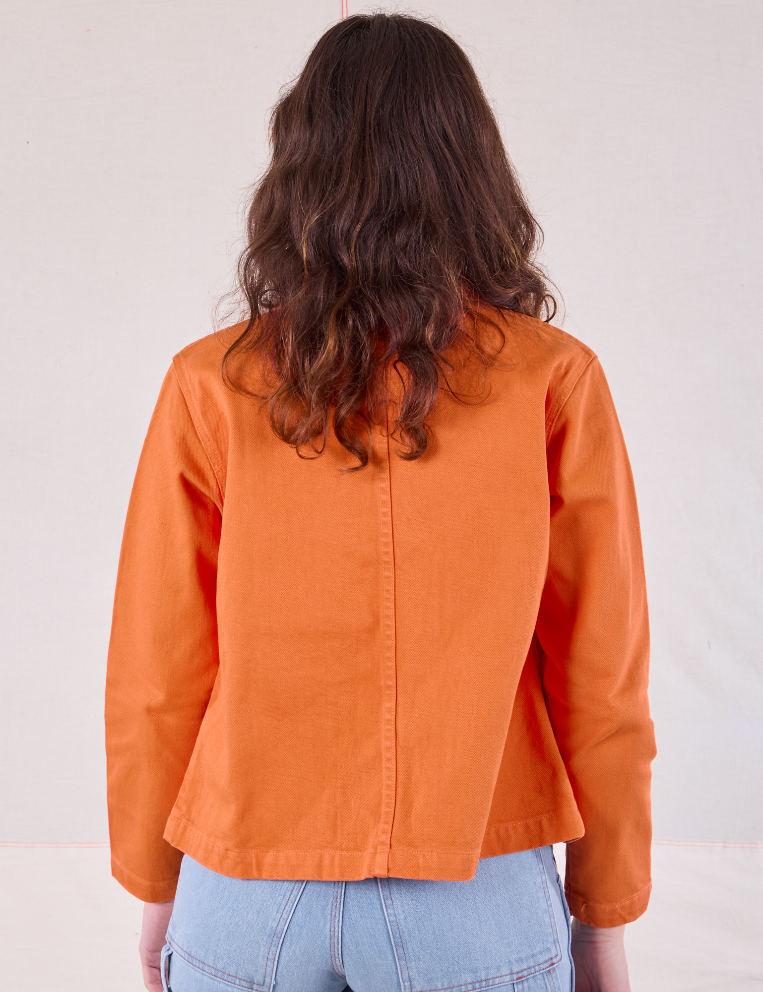 Denim Work Jacket in Construction Orange back view on Alex