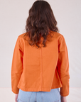 Denim Work Jacket in Construction Orange back view on Alex