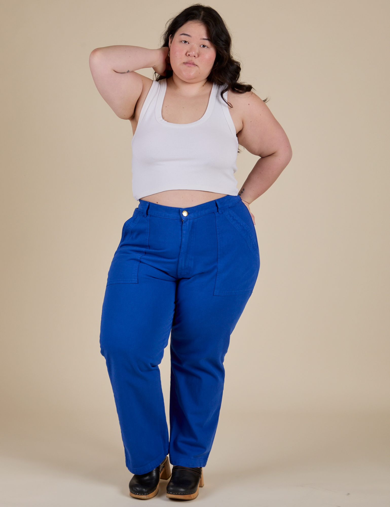 Ashley is wearing Work Pants in Royal Blue and vintage tee white Cropped Tank