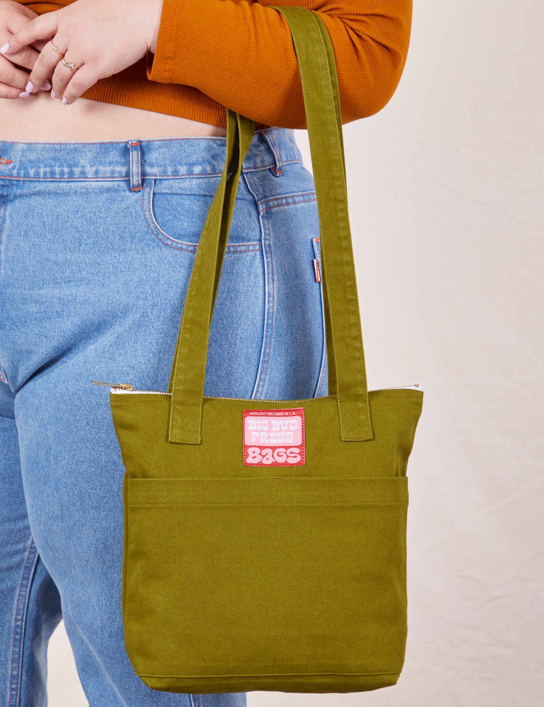 Over-Shoulder Zip Mini Tote in Olive Ground on model's arm