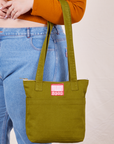 Over-Shoulder Zip Mini Tote in Olive Ground on model's arm