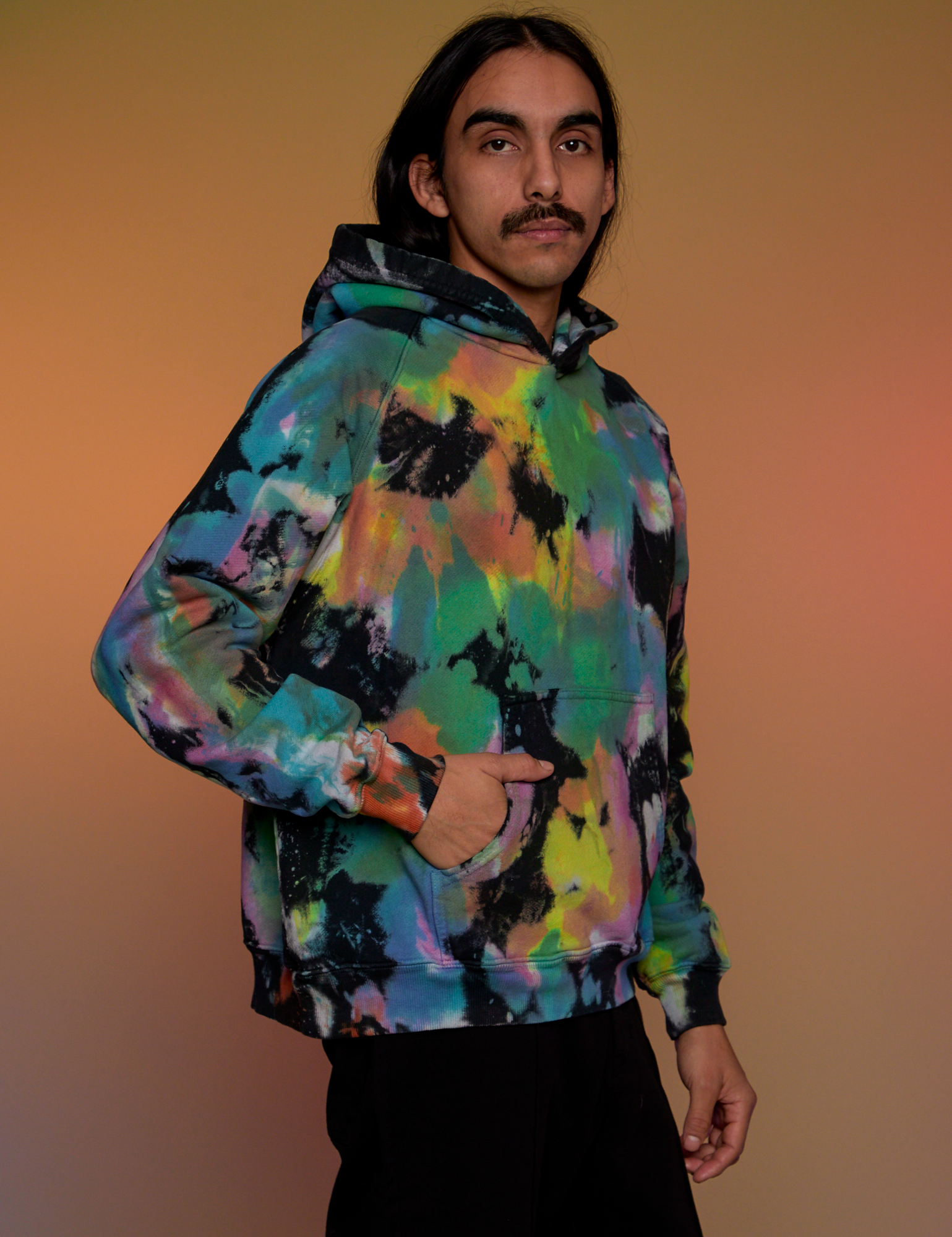 Oversized Hoodie in Rainbow Magic Waters side view on Anthony