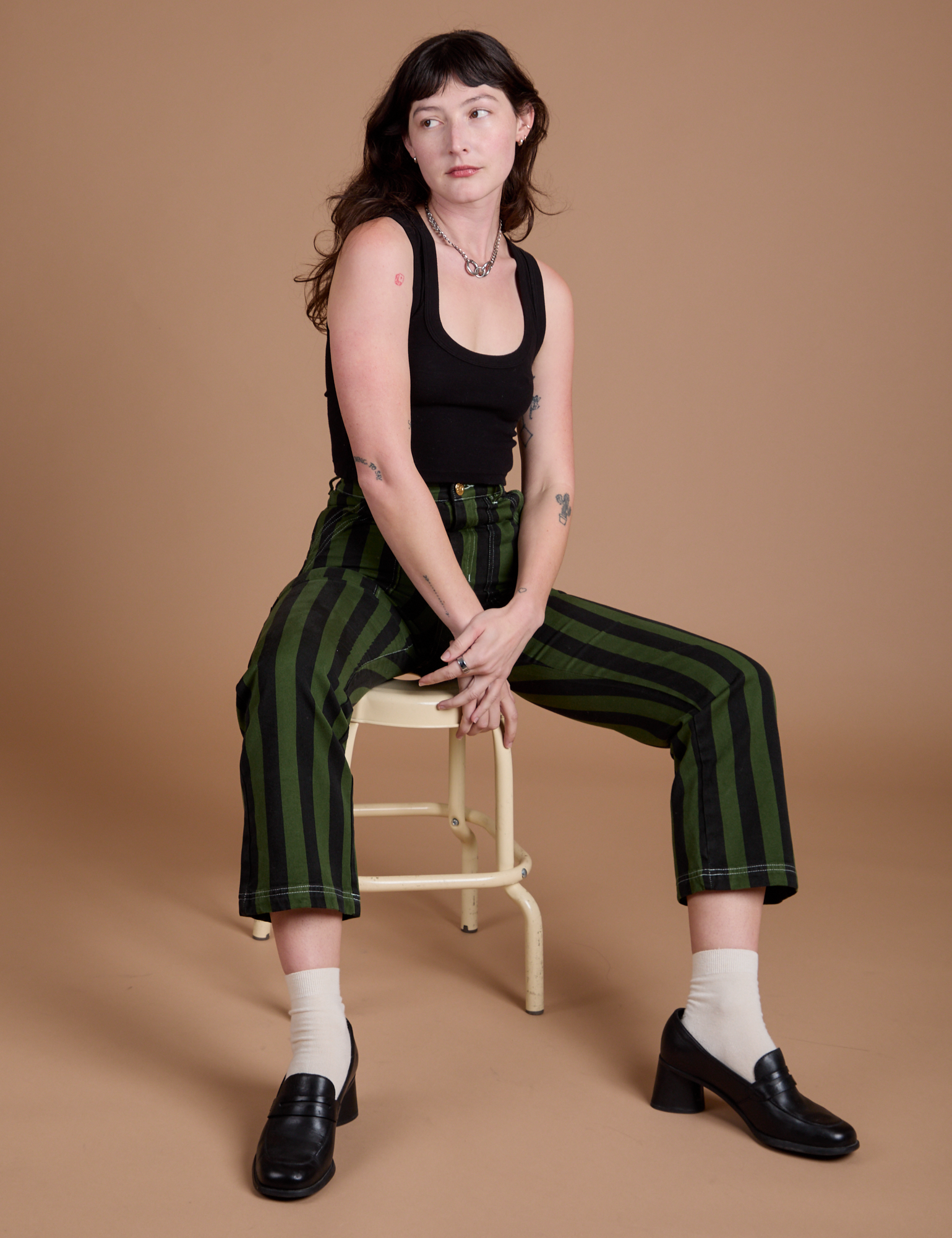 Black Stripe Work Pants in Evergreen and black Cropped Tank on Alex