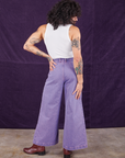 Back view of Overdyed Wide Leg Trousers in Faded Grape and vintage off-white Tank Top on Jesse
