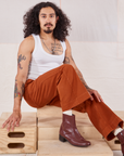 Jesse is wearing Action Pants in Burnt Terracotta and Cropped Tank in vintage tee off-white