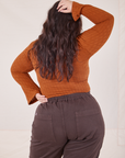 Back view of Bell Sleeve Top in Burnt Terracotta and espresso brown Western Pants worn by Ashley