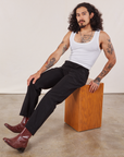 Jesse is wearing Work Pants in Black and Cropped Tank in vintage tee off-white