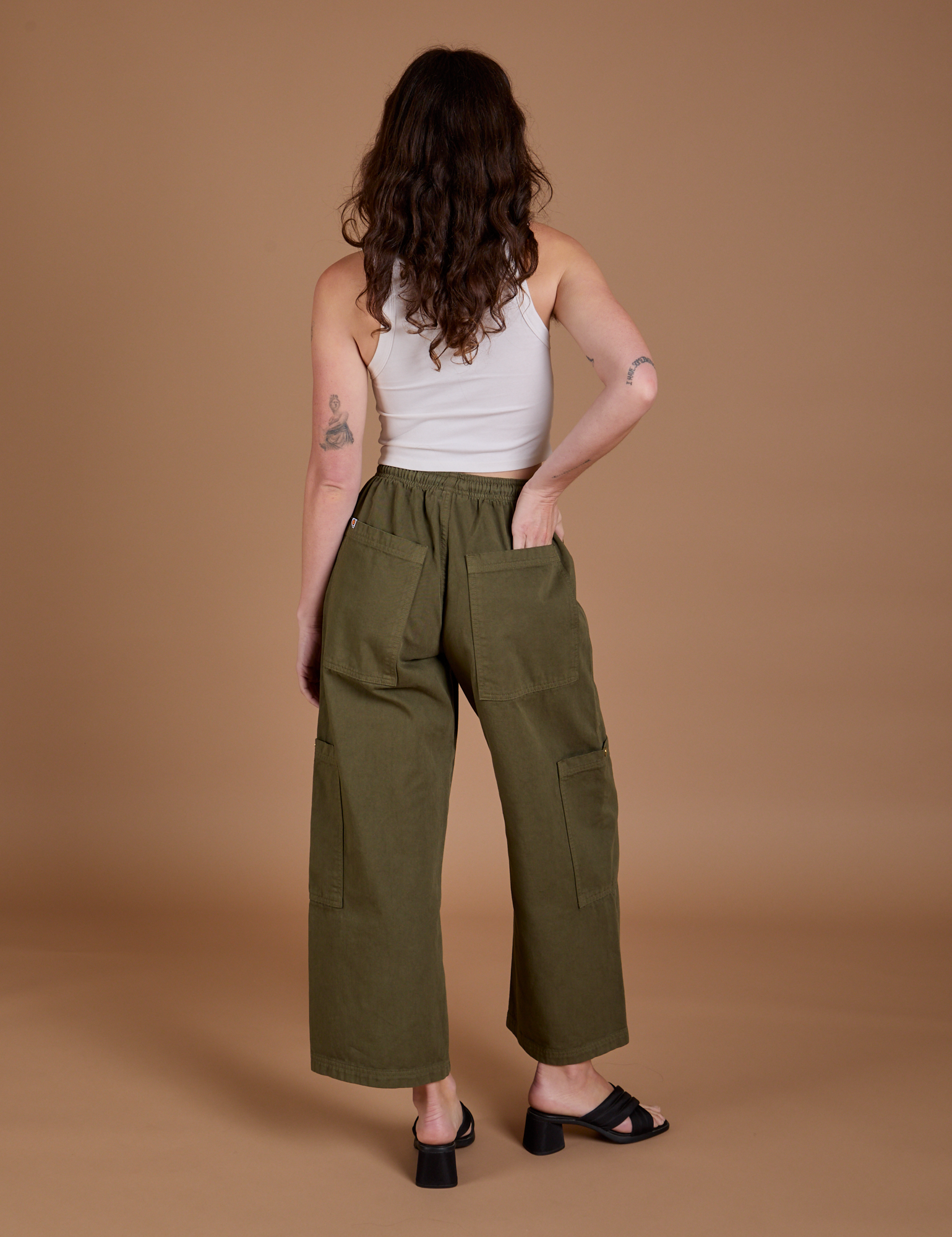 Back view of Drop Pocket Cargo Pants in Surplus Green on Alex