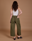 Back view of Drop Pocket Cargo Pants in Surplus Green on Alex