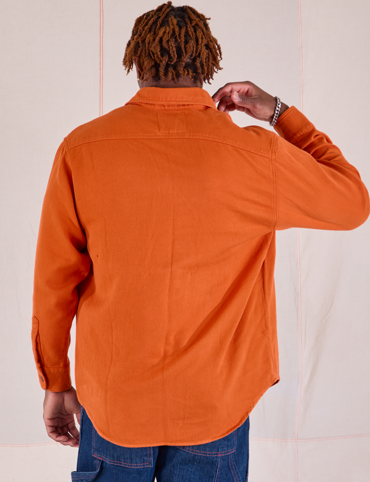 Flannel Overshirt in Burnt Orange back view on Isaac