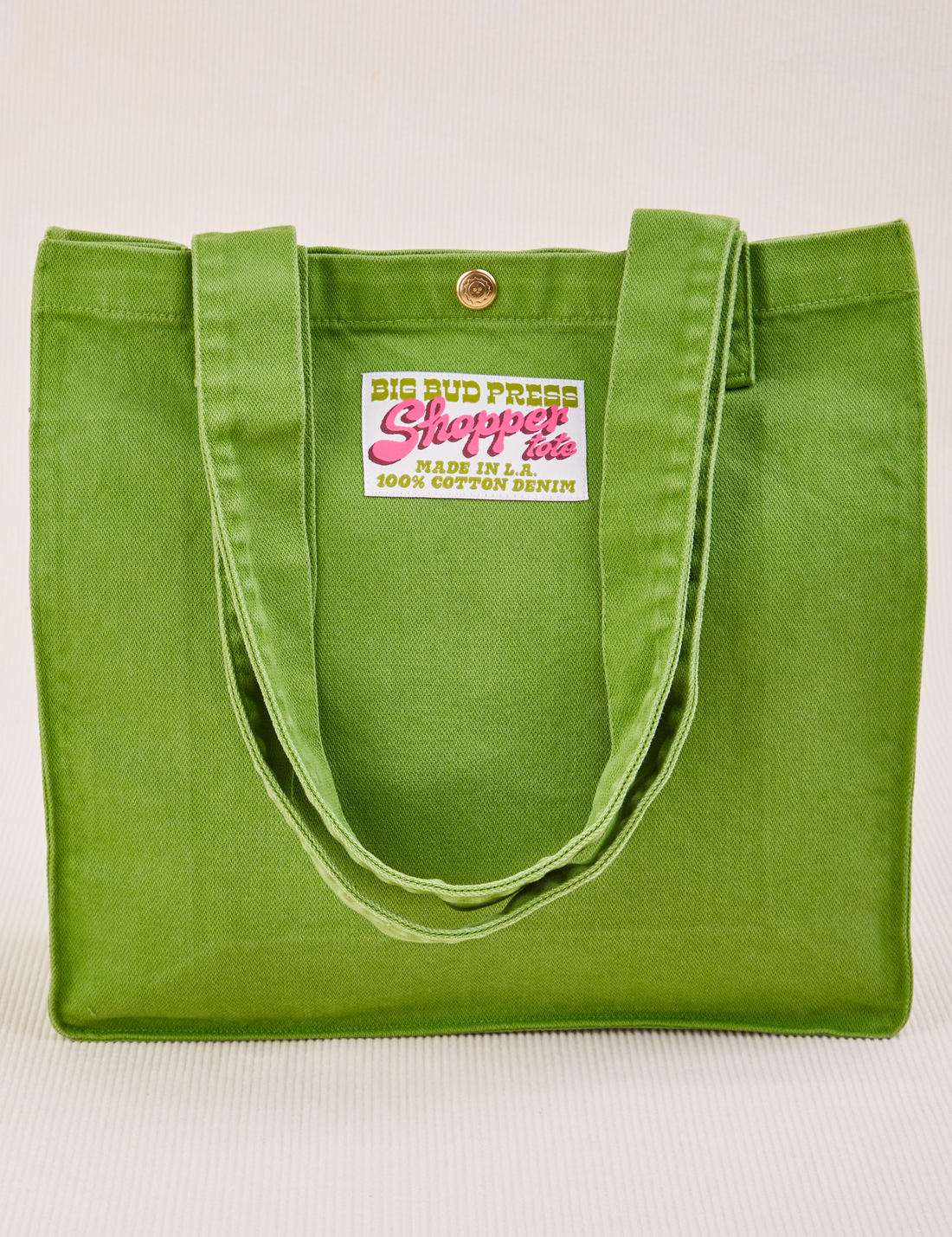 Shopper Tote Bag in Bright Olive with straps hanging down front of bag