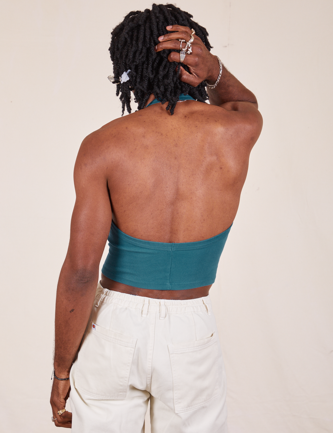 Back view of Halter Top in Marine Blue and vintage off-white Western Pants worn by Jerrod