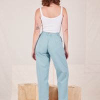 Back view of Heavyweight Trousers in Baby Blue and vintage off-white Cropped Cami worn by Alex