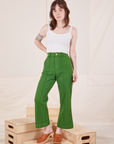 Hana is 5'3" and wearing XXS Petite Heritage Westerns in Lawn Green paired with Cropped Cami in vintage tee off-white 
