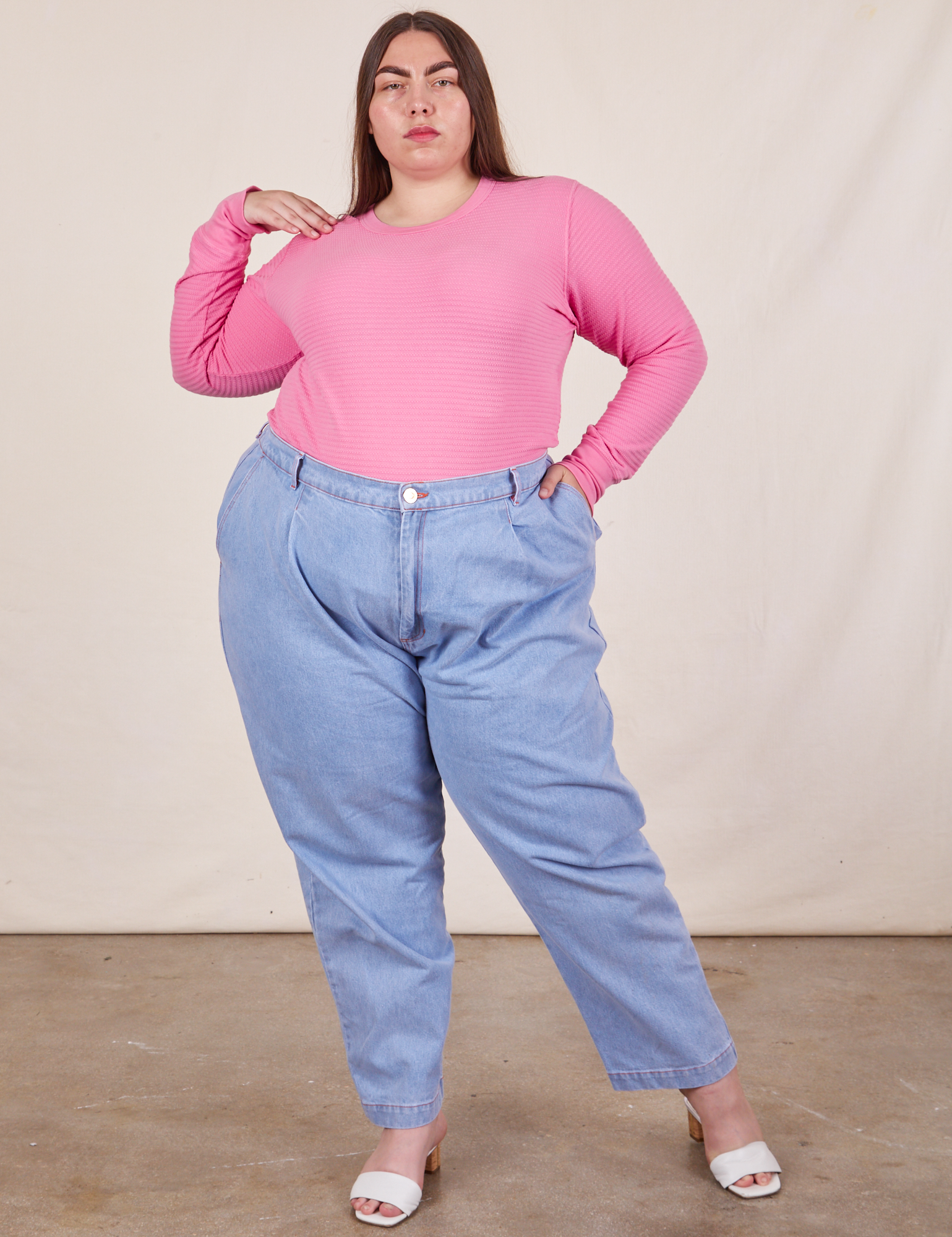 Marielena is wearing Honeycomb Thermal in Bubblegum Pink tucked into light wash Denim Trousers