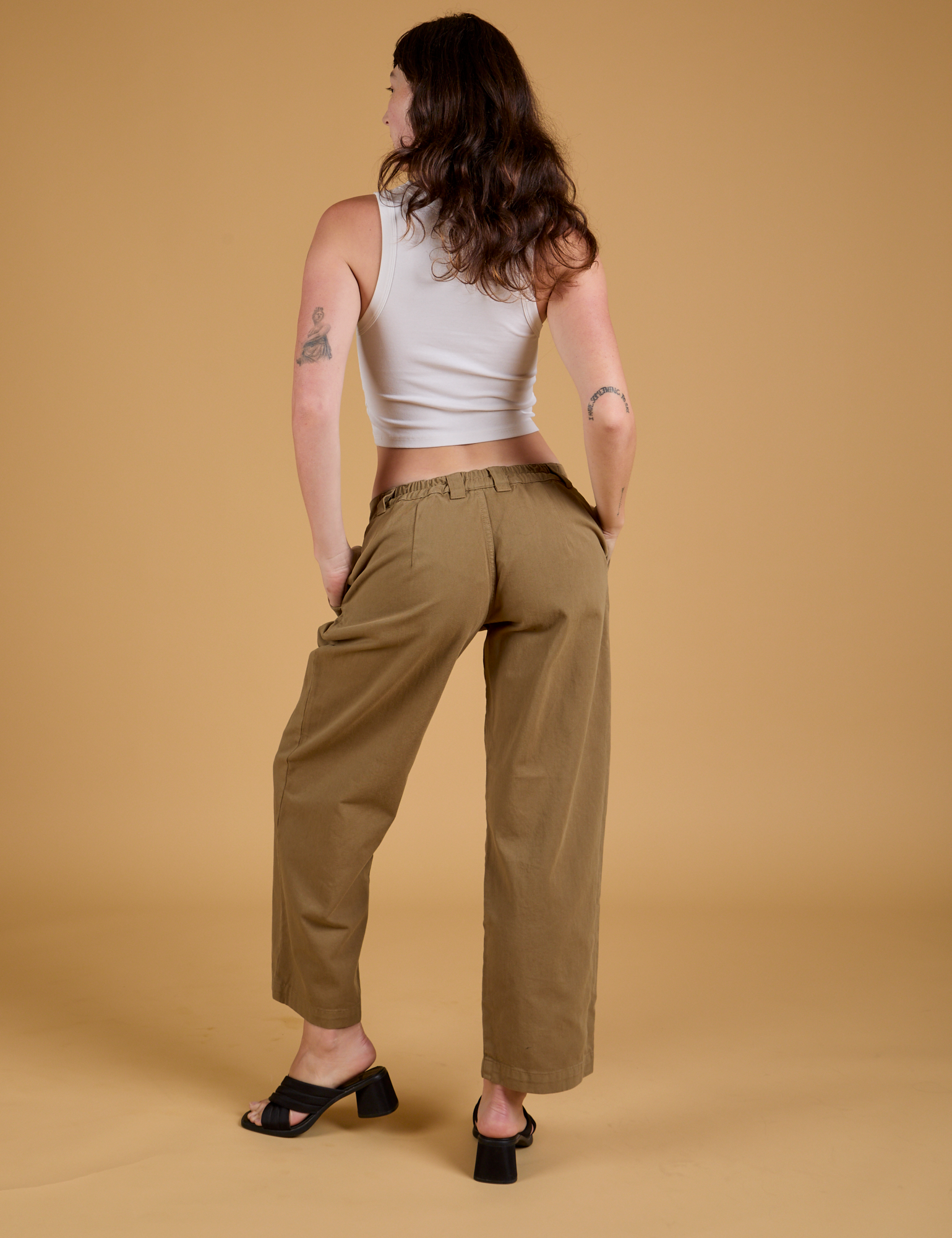 Baggy Mid-Rise Trousers in Desert Brown back view on Alex 