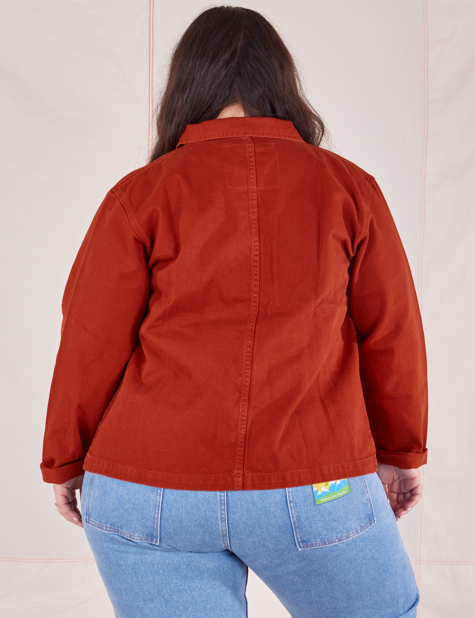 Back view of Denim Work Jacket in Paprika worn by Ashley