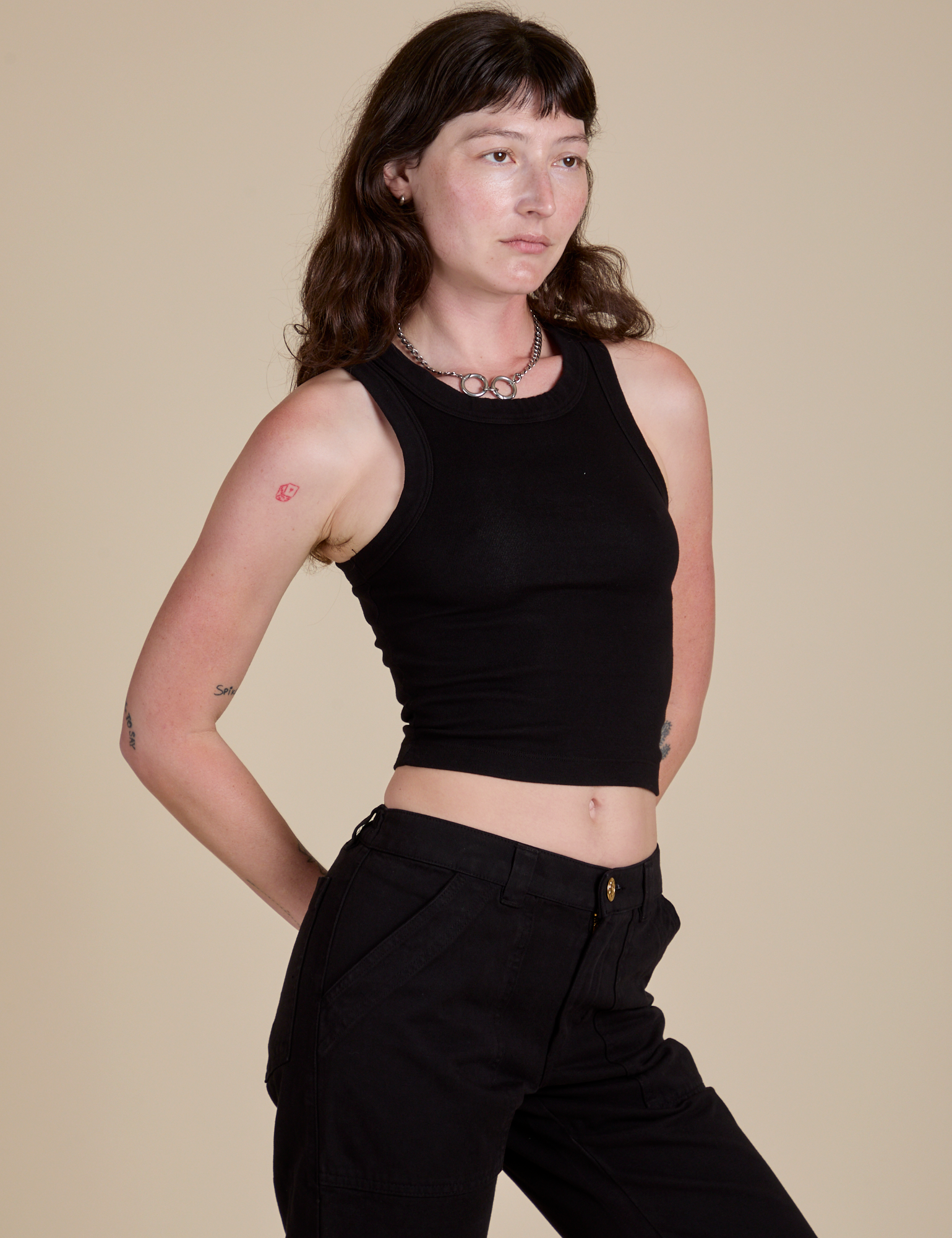 Racerback Tank in Black angled front view on Alex