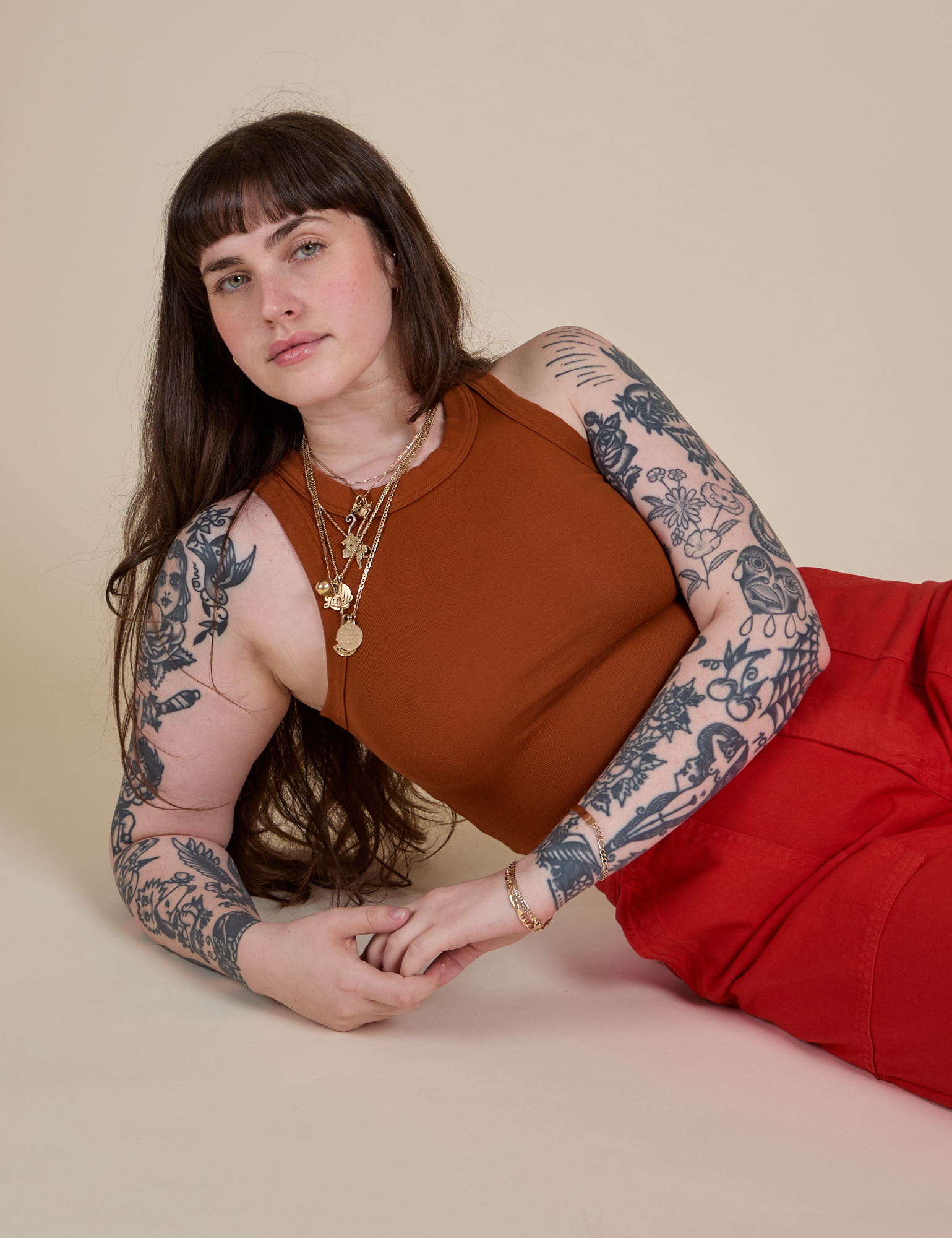 Sydney is wearing Racerback Tank in Burnt Terracotta