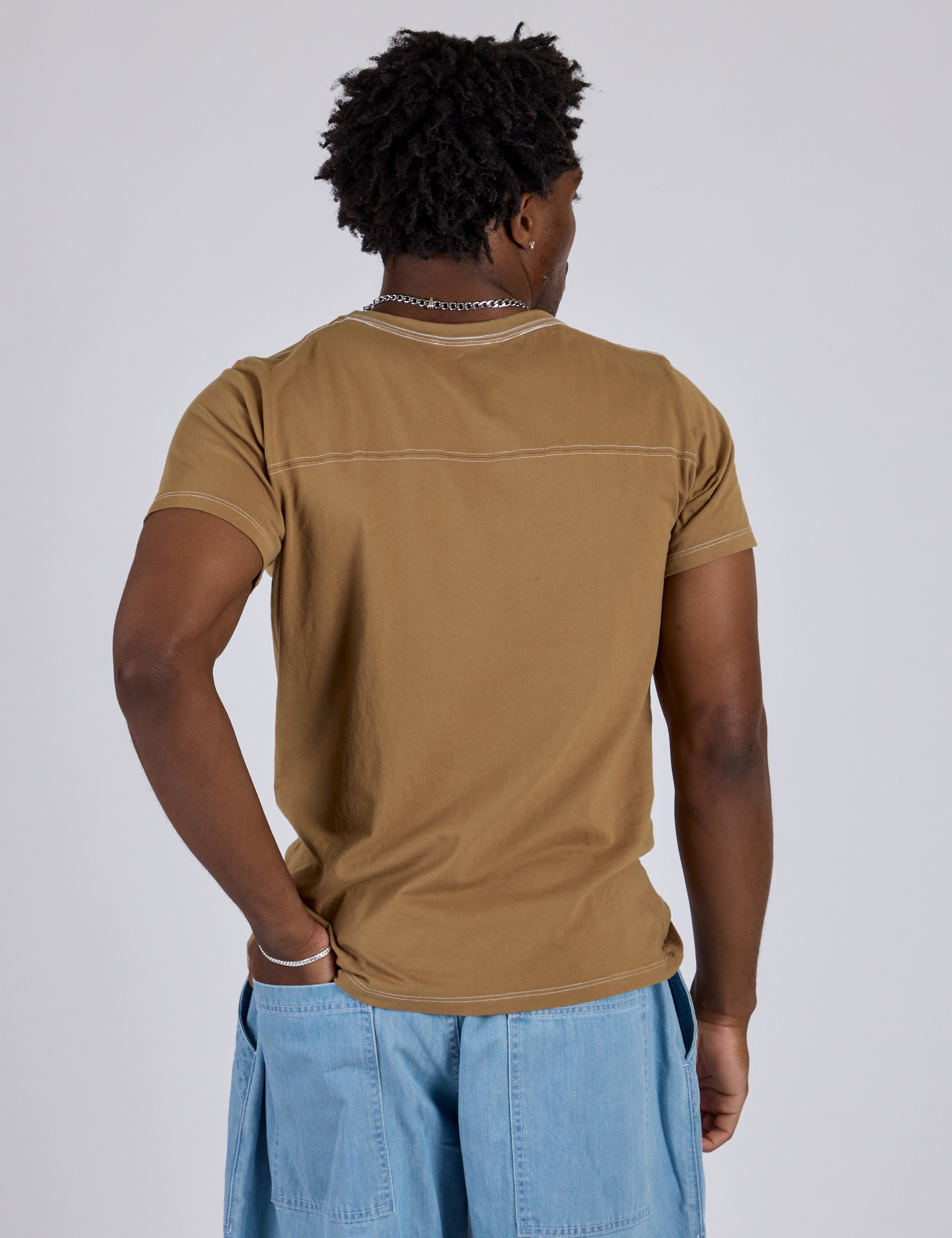 Jr. Varsity Tee in Desert Brown back view on Isaac