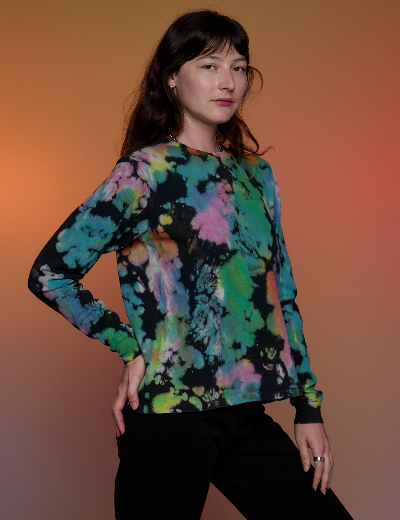 Angled front view of Magic Waters Long Sleeve Burly Tee in Rainbow on Alex