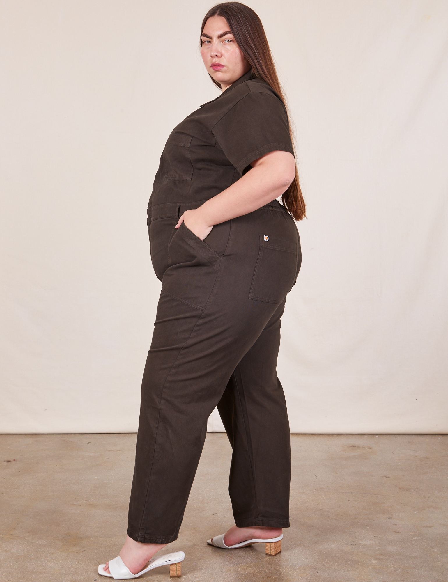 Side view of Short Sleeve Jumpsuit in Espresso Brown worn by Marielena