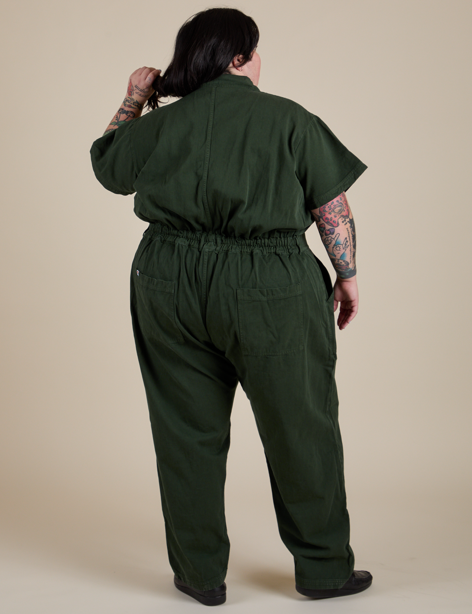 Short Sleeve Jumpsuit in Swamp Green back view on Sam