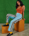 Kandia is wearing Mismatched Stripe Work Pants and burnt terracotta Cropped Tank Top