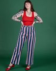 Sydney is 5’9” and wearing M Work Pants in Pacific Stripe paired with mustang red Cropped Tank