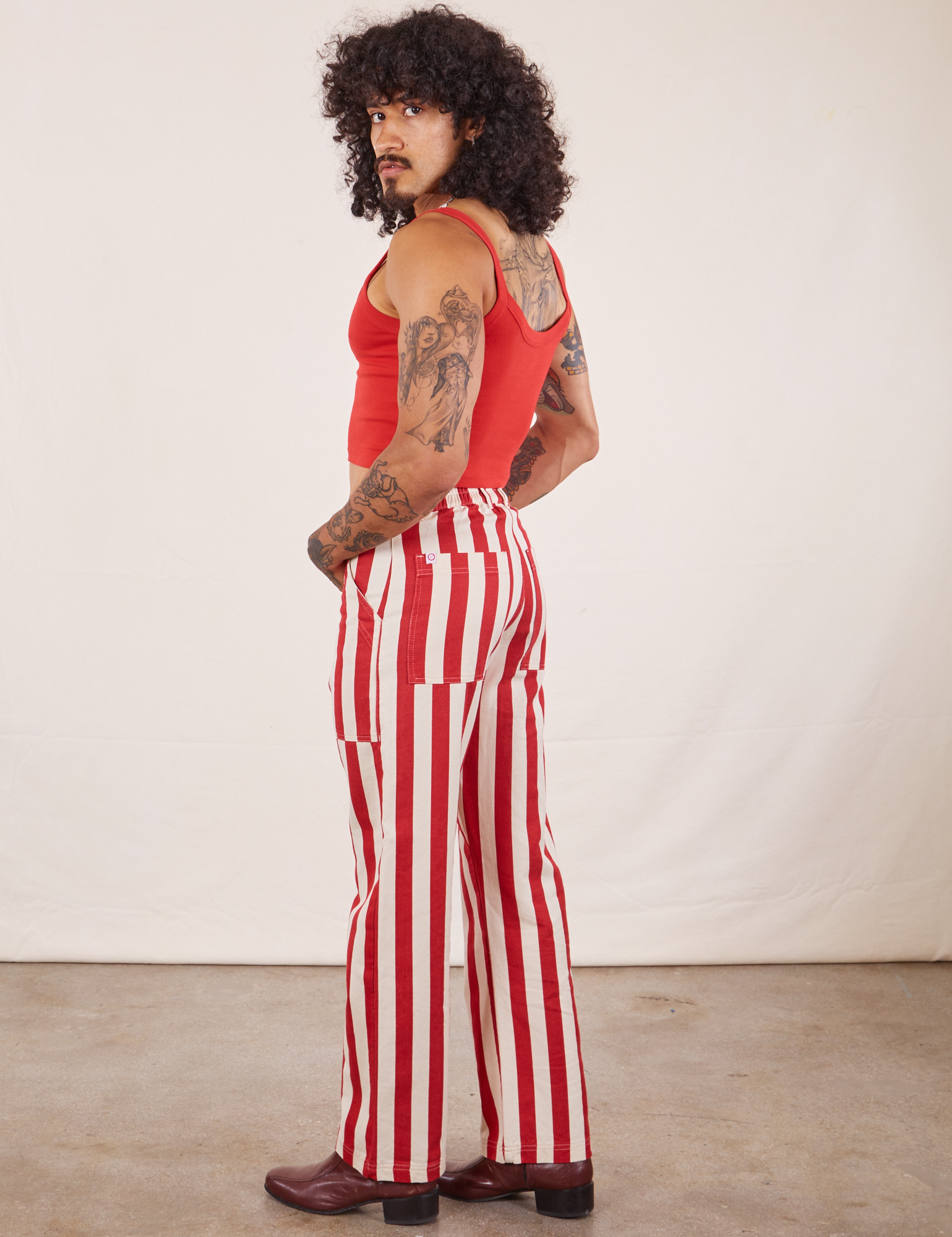 Side view of Work Pants in Cherry Stripe and mustang red Cropped Cami on Jesse