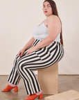 Marielena is wearing Black Striped Work Pants in White and vintage off-white Cropped Cami