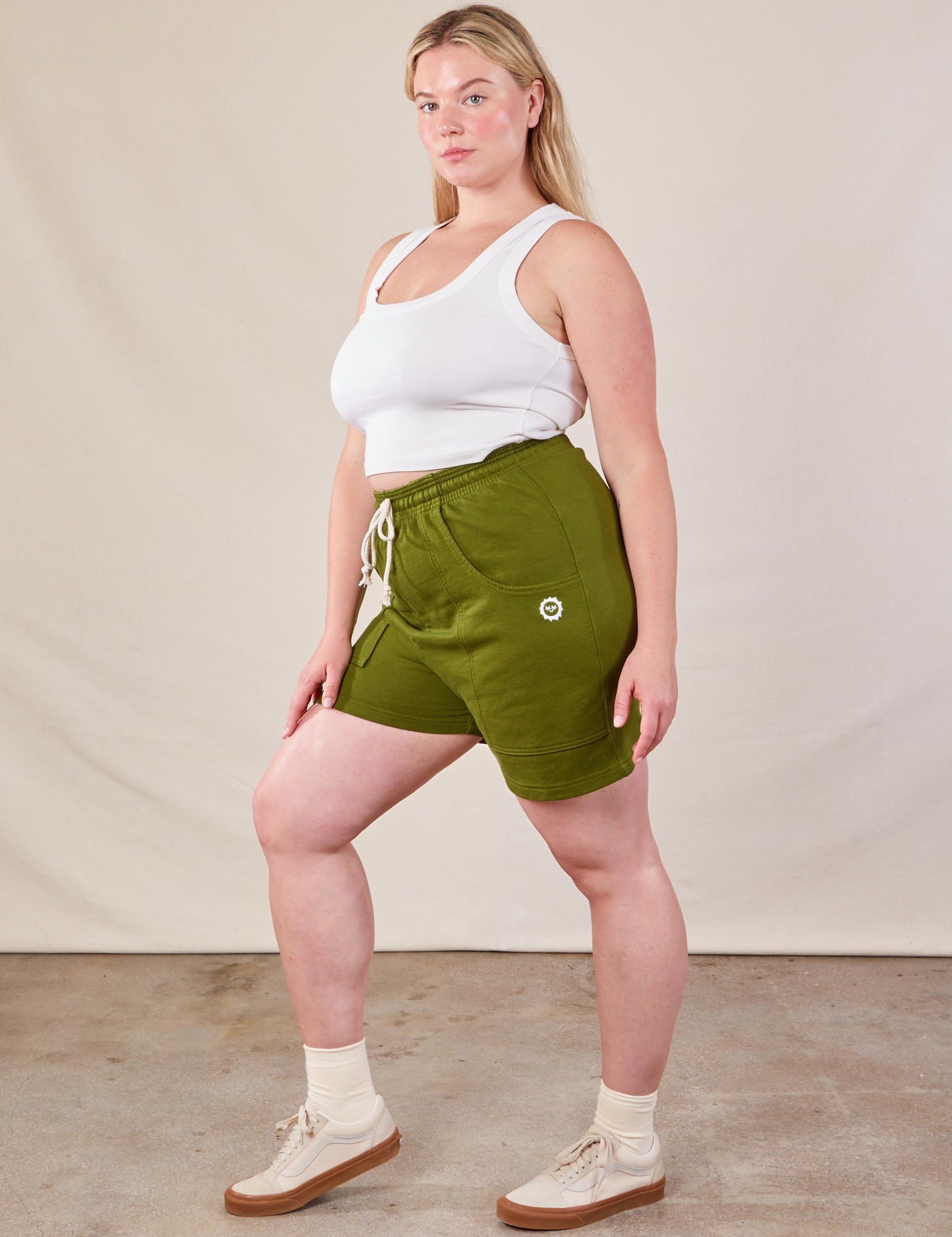 Side view of Lightweight Sweat Shorts in Summer Olive and Cropped Tank in vintage tee off-white on Lish