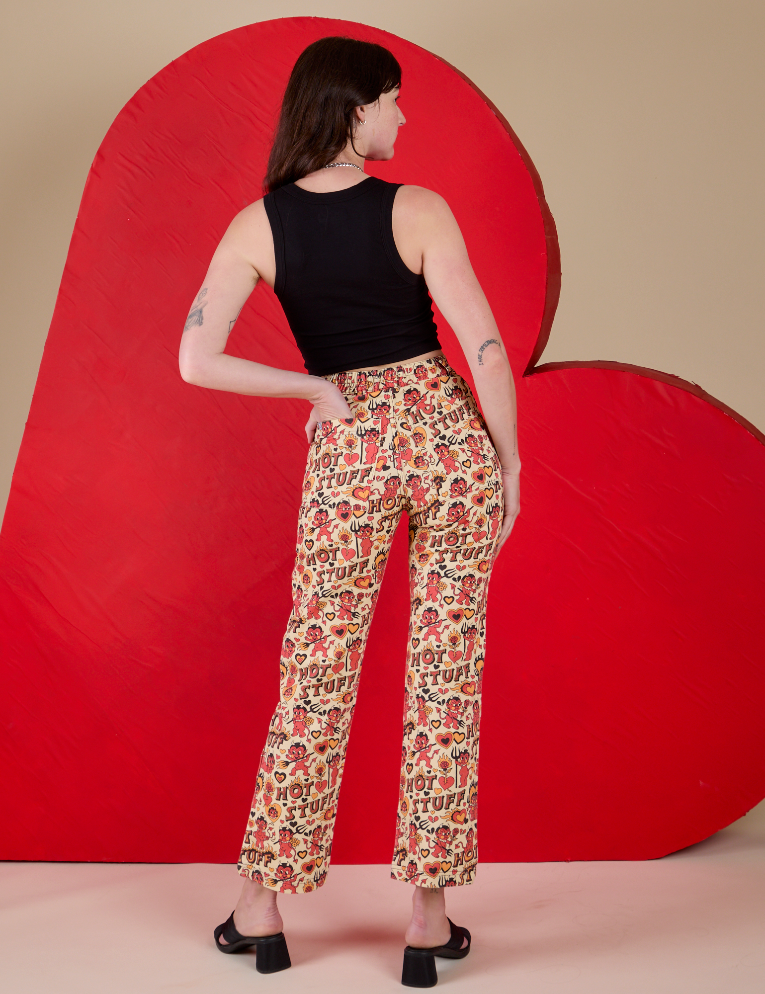 Back view of Work Pants in Hot Stuff Print and black Cropped Tank on Alex