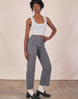 Angled front view of Work Pants in Washed Grey and Cropped Tank in Vintage Tee Off-White