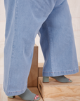 Indigo Wide Leg Trousers in Light Wash pant leg side close up on Catie
