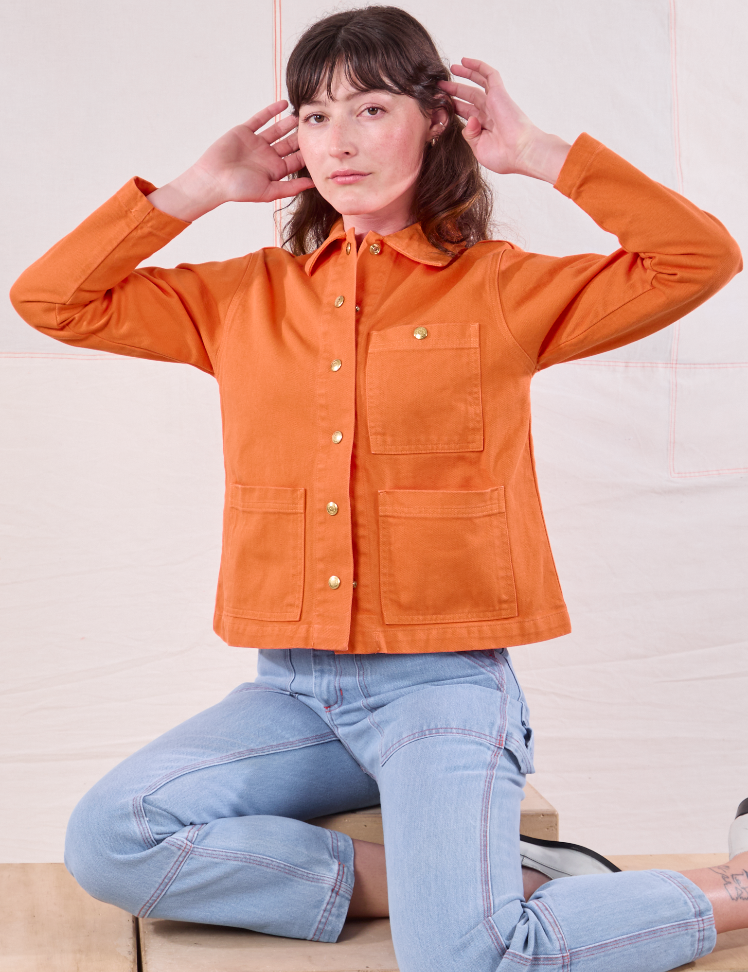 Denim Work Jacket in Construction Orange and light wash Carpenter Jeans on Alex